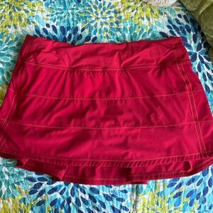 Pace Rival Mid-Rise Skirt in the color red size 10
